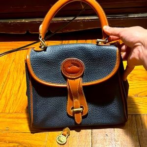 Dooney & Bourke Navy Pebble Leather Grain handbag. No strap
